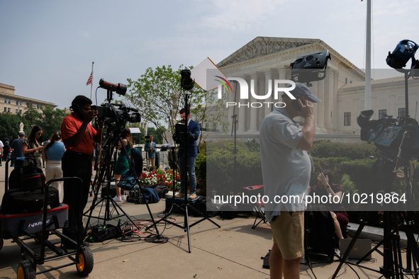 Members of the media gather outside of the Supreme Court in Washington, D.C. on June 30, 2023 following the Supreme Court's ruling that Pres...