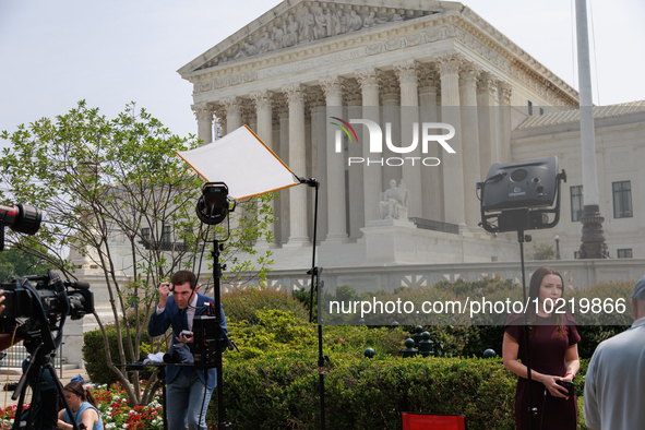 Members of the media gather outside of the Supreme Court in Washington, D.C. on June 30, 2023 following the Supreme Court's ruling that Pres...