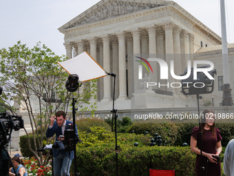 Members of the media gather outside of the Supreme Court in Washington, D.C. on June 30, 2023 following the Supreme Court's ruling that Pres...