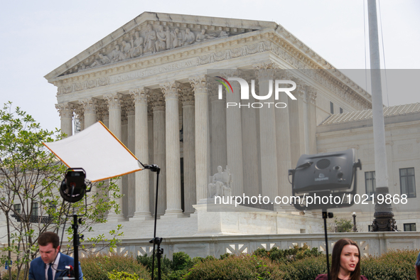 Members of the media gather outside of the Supreme Court in Washington, D.C. on June 30, 2023 following the Supreme Court's ruling that Pres...