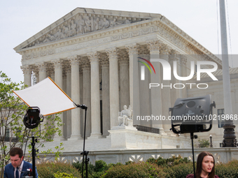 Members of the media gather outside of the Supreme Court in Washington, D.C. on June 30, 2023 following the Supreme Court's ruling that Pres...