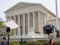 Members of the media gather outside of the Supreme Court in Washington, D.C. on June 30, 2023 following the Supreme Court's ruling that Pres...