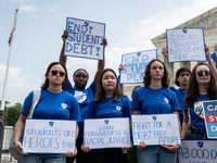 Students protest the Supreme Court's ruling against President Joe Biden’s student-debt relief program.  The opinion does not prohibit studen...