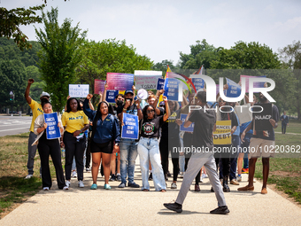 Students march to the White House in protest of the Supreme Court's ruling against President Joe Biden’s student-debt relief program.  The o...