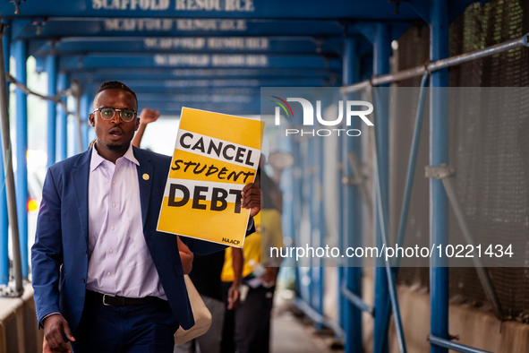 Wisdom Cole, National Director of the NAACP Youth and College Division, partcipates in a march protesting the Supreme Court's ruling against...