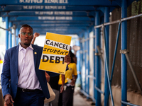 Wisdom Cole, National Director of the NAACP Youth and College Division, partcipates in a march protesting the Supreme Court's ruling against...