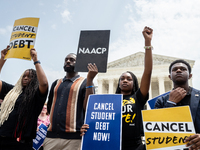 Students protest the Supreme Court's ruling against President Joe Biden’s student-debt relief program.  The opinion does not prohibit studen...