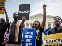 Students protest the Supreme Court's ruling against President Joe Biden’s student-debt relief program.  The opinion does not prohibit studen...