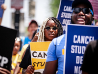 Students depart on a march to the White House in protest of the Supreme Court's ruling against President Joe Biden’s student-debt relief pro...