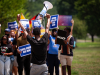 Derrick Lewis of the NAACP leads a march protesting the Supreme Court's ruling against President Joe Biden’s student-debt relief program.  T...