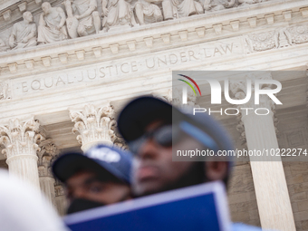 Students protest the Supreme Court's ruling against President Joe Biden’s student-debt relief program.  The opinion does not prohibit studen...