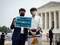 Asian-Americans protest against the US Supreme Court ruling that universities cannot consider race in admissions.  The pair of cases brought...