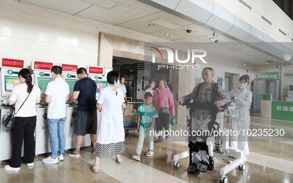 

Medical staff are using a lower limb rehabilitation robot to help patients recover in Chongqing, China, on July 4, 2023. 