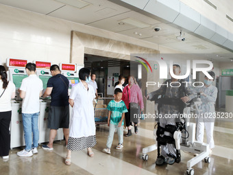 

Medical staff are using a lower limb rehabilitation robot to help patients recover in Chongqing, China, on July 4, 2023. (