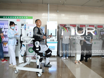 

Medical staff are using a lower limb rehabilitation robot to help patients recover in Chongqing, China, on July 4, 2023. (