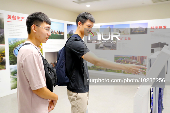 

Two college students from Taiwan are interacting in a Passive House in Qingdao, Shandong Province, China, on July 4, 2023. 