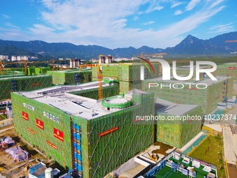 

An aerial photo shows the construction of the new schools of Yuexi Middle School in Anqing City, Anhui Province, China on July 5, 2023. (