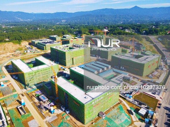 

An aerial photo shows the construction of the new schools of Yuexi Middle School in Anqing City, Anhui Province, China on July 5, 2023. 