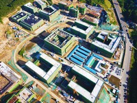 

An aerial photo shows the construction of the new schools of Yuexi Middle School in Anqing City, Anhui Province, China on July 5, 2023. (