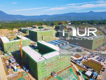 

An aerial photo shows the construction of the new schools of Yuexi Middle School in Anqing City, Anhui Province, China on July 5, 2023. (