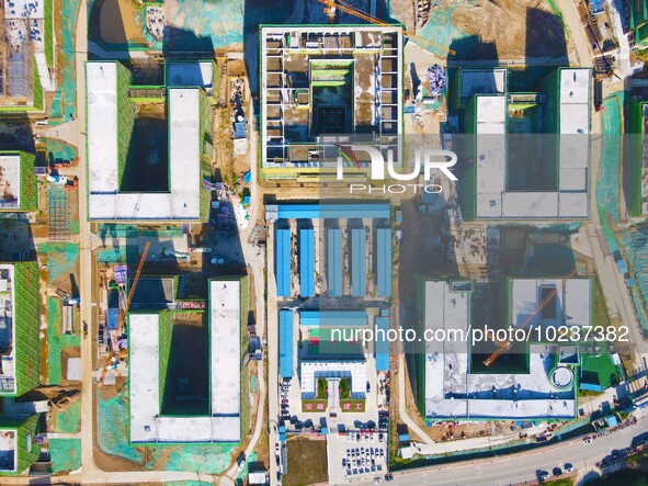 

An aerial photo shows the construction of the new schools of Yuexi Middle School in Anqing City, Anhui Province, China on July 5, 2023. 