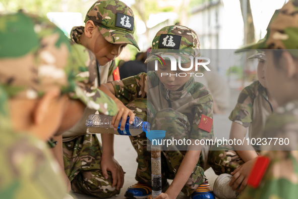 

Children are training during a fresh water filtration program at a military summer camp in Hefei, Anhui Province, China on July 5, 2023. 