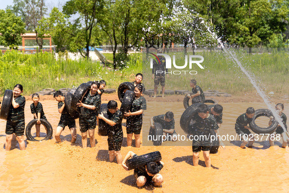 

Children are training during the ''Tactical Quagmire'' program at a military summer camp in Hefei, Anhui Province, China on July 5, 2023. 