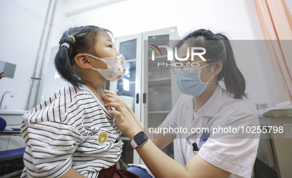 

A medical worker is applying traditional Chinese medicine Sanfu stickers to a citizen in Huai'an City, Jiangsu Province, China, on July 11...