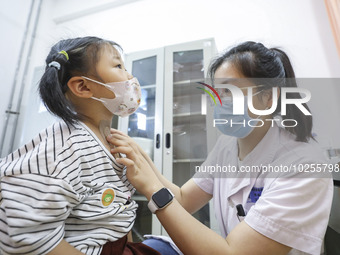 

A medical worker is applying traditional Chinese medicine Sanfu stickers to a citizen in Huai'an City, Jiangsu Province, China, on July 11...