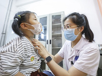 

A medical worker is applying traditional Chinese medicine Sanfu stickers to a citizen in Huai'an City, Jiangsu Province, China, on July 11...