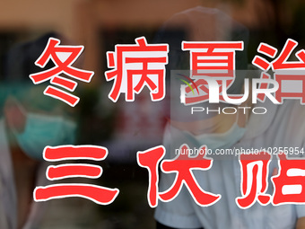 

Medical staff at a traditional Chinese medicine clinic are preparing ''Sanfu stickers'' in Zaozhuang, Shandong province, China, on July 11...