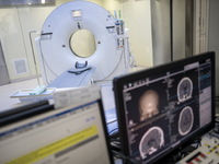 A General view showing a CT Scanner with a screen showing a ct scan of a brain inside the Central Government-aided Emergency Hospital on Jul...