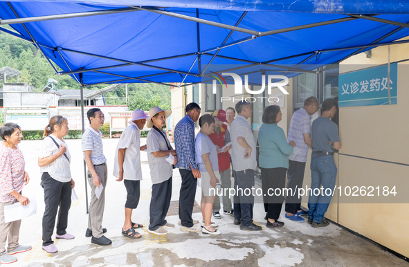 YICHANG, CHINA - JULY 13, 2023 - People receive free medicines at the pharmacy of Central Health center in Yanglinqiao town of Zigui County,...