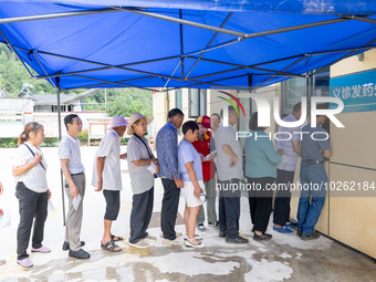 YICHANG, CHINA - JULY 13, 2023 - People receive free medicines at the pharmacy of Central Health center in Yanglinqiao town of Zigui County,...