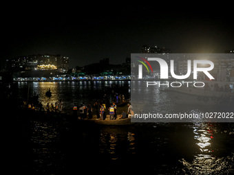 A water bus with more than half a hundred passengers sank after being hit by a sand-laden bulkhead in the Buriganga river at Sadarghat in Dh...