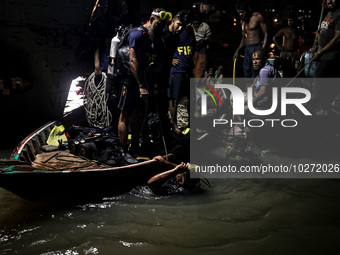 A water bus with more than half a hundred passengers sank after being hit by a sand-laden bulkhead in the Buriganga river at Sadarghat in Dh...