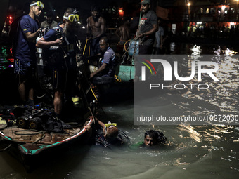 A water bus with more than half a hundred passengers sank after being hit by a sand-laden bulkhead in the Buriganga river at Sadarghat in Dh...