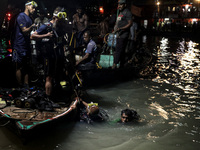 A water bus with more than half a hundred passengers sank after being hit by a sand-laden bulkhead in the Buriganga river at Sadarghat in Dh...