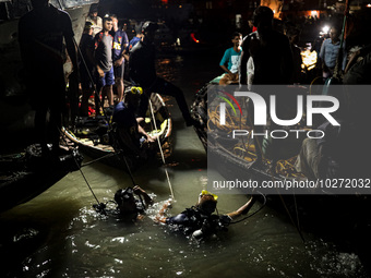 A water bus with more than half a hundred passengers sank after being hit by a sand-laden bulkhead in the Buriganga river at Sadarghat in Dh...