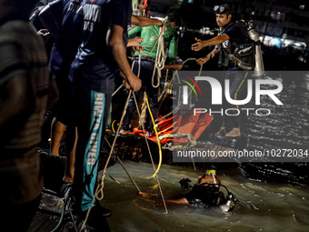 A water bus with more than half a hundred passengers sank after being hit by a sand-laden bulkhead in the Buriganga river at Sadarghat in Dh...