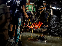 A water bus with more than half a hundred passengers sank after being hit by a sand-laden bulkhead in the Buriganga river at Sadarghat in Dh...