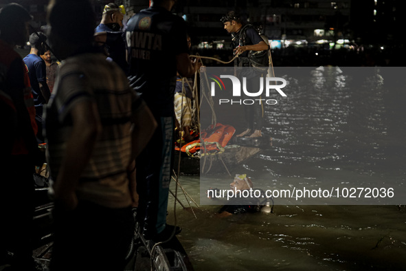 A water bus with more than half a hundred passengers sank after being hit by a sand-laden bulkhead in the Buriganga river at Sadarghat in Dh...