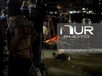 A water bus with more than half a hundred passengers sank after being hit by a sand-laden bulkhead in the Buriganga river at Sadarghat in Dh...