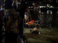 A water bus with more than half a hundred passengers sank after being hit by a sand-laden bulkhead in the Buriganga river at Sadarghat in Dh...