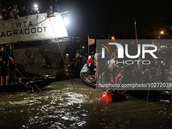 A water bus with more than half a hundred passengers sank after being hit by a sand-laden bulkhead in the Buriganga river at Sadarghat in Dh...