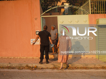 Residents are leaving their houses  during a wildfire in southern urban of Attica, Greece, on 17, July 2023. Fire fighting forces battling a...