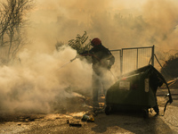 Fireman is fighting the fire  during a wildfire in southern urban of Attica, Greece, on 17, July 2023. Fire fighting forces battling a blaze...