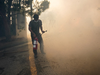 Fireman is fighting the fire  during a wildfire in southern urban of Attica, Greece, on 17, July 2023. Fire fighting forces battling a blaze...