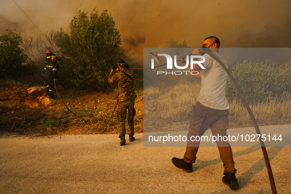 Fire during a wildfire in southern urban of Attica, Greece, on 17, July 2023. Fire fighting forces battling a blaze that broke out on Monday...