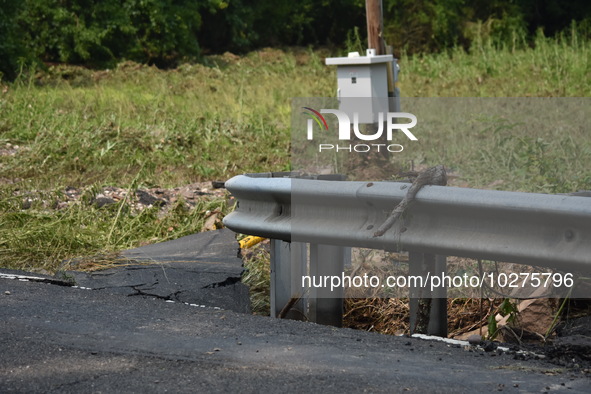 LOWER MAKEFIELD TOWNSHIP, PENNSYLVANIA, UNITED STATES - JULY 17 - Severe flooding damage and buckling roads in Lower Makefield Township, Pen...